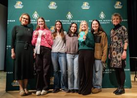 Third place group division (from left): Provost Anne Dahlman, Megan Wells, Faculty Adviser Amber LaCrosse, Lily Briggs, Isabella Enger, Jayme Pomper, and Dean Lisa Schade Eckert.