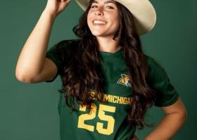 Sami Brown wearing her hat and soccer jersey