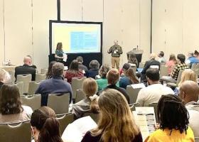 Savage and Abromowitz delivering their conference presentation