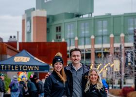 Corgan (center) outside Lambeau Field