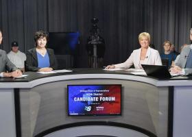 The media representatives and moderator participating in the debate (LaCombe, Walton, Peterson and Settles)