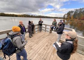 Students lead a "practice tour" along the Dead River