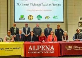 NMU's Joe Lubig (front left) and other representatives involved with the teacher pipeline.