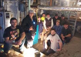 Syrja (seated front right) with his HVAC/R classmates who helped to install the new boiler.