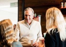 Schultz interacting with students in the campus Starbucks during his October visit
