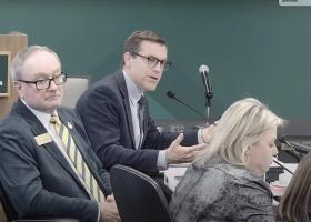 NMU President Brock Tessman (center) at the board meeting with Chair Steve Young and Vice Chair Alexis Hart