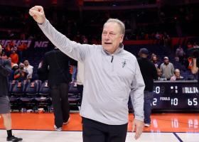 Tom Izzo motions to fans after his record-setting win