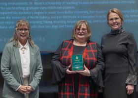 Assistant Professor Cindy Basse (center) with Liz Wuorinen, dean of the College of Health Sciences and Professional Studies (left) and Provost Anne Dahlmanand Provost Anne Dahlman