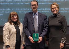 Michael Crum (center) with College of Business Dean Carol Johnson (left) and Provost Anne Dahlman