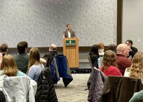 Tessman addressing the large audience of faculty, staff, students and community members in the Northern Center Ballrooms.
