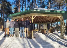 Construction management students in front of the new pavilion they built on campus.