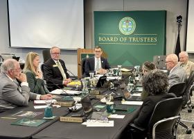 President Brock Tessman (back left) participates in his final NMU Board of Trustees meeting.