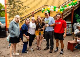 Photo of attendees at a summer 2024 Alumni Happy Hour