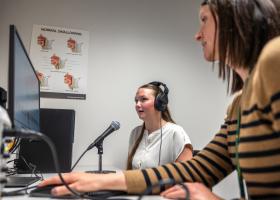 Isaacson (right) and a student in NMU's Speech-Language-Hearing Clinic