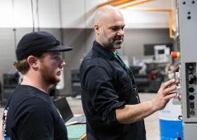 NMU Engineering Technology Professor Cale Polkinghorne with a student