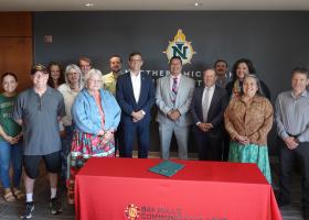 Bay Mills Community College President Duane Bedell is pictured center, between former NMU President Brock Tessman and current Interim President Gavin Leach at the late June signing ceremony on campus, which was also attended by representatives of NMU's Center for Native American Studies and School of Education.