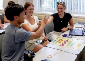 Schultz Fellows play Northern Money Games to promote financial literacy.