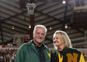 Steve and Gayle Mariucci, with his symbolic jersey suspended from the Superior Dome rafters in the background.