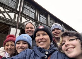 Olsen in back with his son, Ross. In front are (from left) his mother-in-law, Janet; daughter Charlotte; wife Jennifer; and daughter Emma.