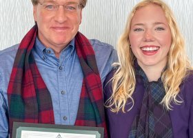 Ryan Bond with an NMU Innovation Award, standing alongside May 2025 graduate Lindsey Locke. He introduced her to the Congress-Bundestag Youth Exchange (CBYX) for Young Professionals program and, with the help of his mentorship, she was one of 65 Americans selected to study and work in Germany for a year.