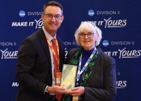 Diane Husic receiving her award