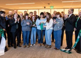Members of the NMU community are joined by architectural firm and construction company representatives in celebrating the completed Phase I renovations.