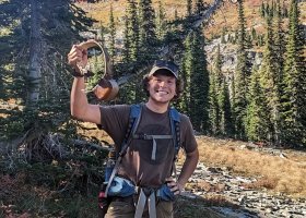 Andexler holding a GPS collar