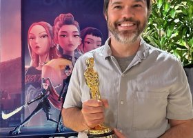 Thorburn holding an Oscar at Sony Pictures Animation's celebration