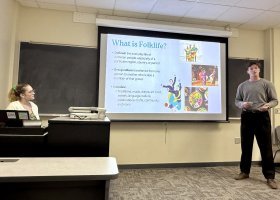 Student Truman Maher presents his group's findings to Ewalt, Truckey and the class.