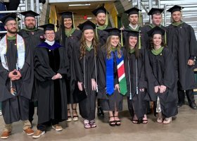 Rochester (third from left) with faculty colleagues and May 2026 athletic training graduates.