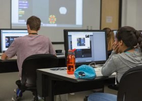 NMU stock photo of youth in a computer lab on campus