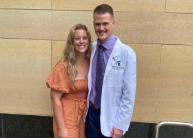 Dylan Bilicki with his wife, Angela, who also graduated from NMU.