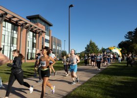 Participants in last year's Mind Over Miles 5K start the race near Jamrich Hall on NMU's campus.