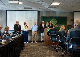 NMU Executive Vice President for Finance and Administration pays special recognition to Educational Access Network staff during the Sept. 18 Board of Trustees meeting. EAN staff in attendance were, from left, Don Salo, Lauren Polick, Chris Lewis, Eric Smith and Matt Franti.