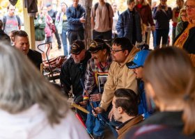 People gather to listen to a drum circle on NMU's campus