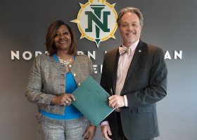 Bay College and NMU Presidents are pictured