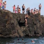 Image of Shawn Robinson-Sobczak jumping off Black Rocks to save someone