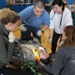 Nursing students respond to patient with a head injury.