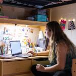 Student studying in residence hall (stock photo)