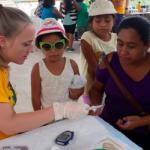 NMU community health graduate Erin Messerschmidt at a community health fair in Belize, May 2019.