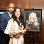 DaVarryl and wife Jennifer with his framed image from the ceremony (J Mariah Images)