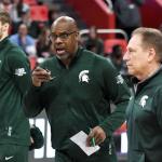 Garland (center) left his spot on Izzo's bench for a period this past season while his son recovered from heart surgery in Cleveland (photo by Nick King/Lansing State Journal).