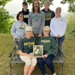 Pictured in the photo seated are Karen Baker Valot ‘75 and Joan Baker Kelley ‘72, holding a photo of mother Alice Westman Baker ‘38, taken on her graduation day. Standing are her grandchildren Alicia Valot Powers ‘08, Shawn Kelley ‘00, and Rebecca Kelley Valot ‘98. Incoming NMU students Jaren Valot and Noah Valot are continuing the family tradition.
