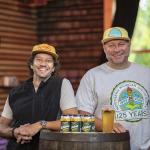 Left to right: NMU alumni Steve Farr (’09 BS, ’12 MBA), Blackrocks' "Pirate of Propoganda" and Andy Langlois ('95 BS), Blackrocks co-owner, with the branded Wildcat Gold Lager cans.