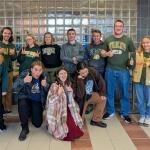 Members of the three NMU Quiz Bowl squads pictured with coach Michael Joy at right.