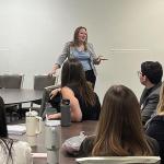 Hetrick (standing) meets with business students from Kent State University (B&W Enterprises LinkedIn photo)